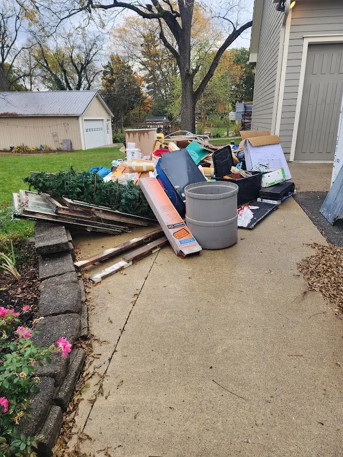 Dumpster being loaded with debris for Demolition Dumpster Rental in Mulberry